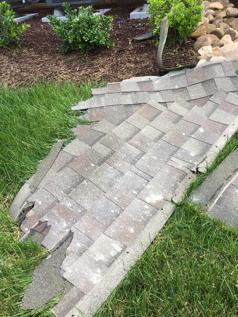 Damaged shingles torn off during the mortar-stain repair in Gallatin, TN