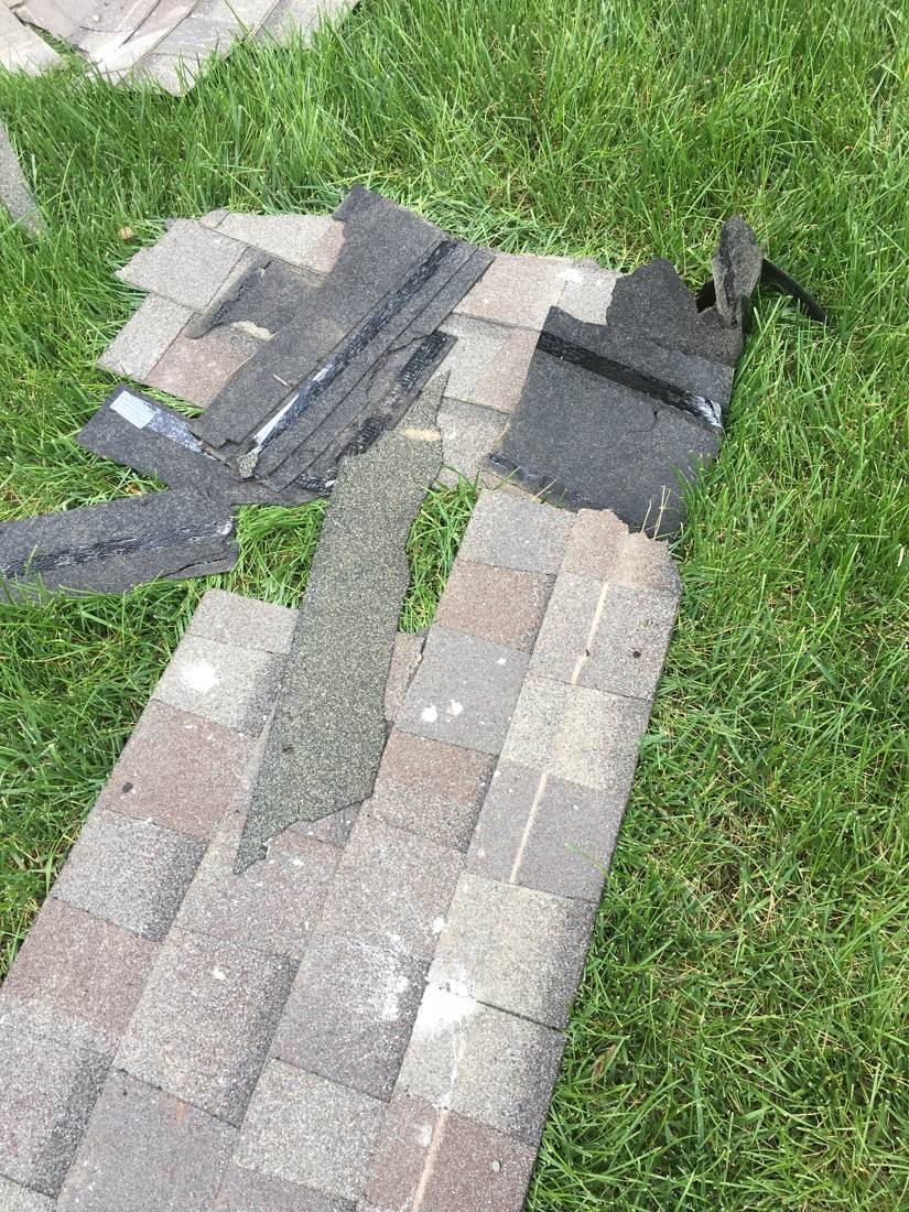 Mortar-stained shingles removed from the roof deck