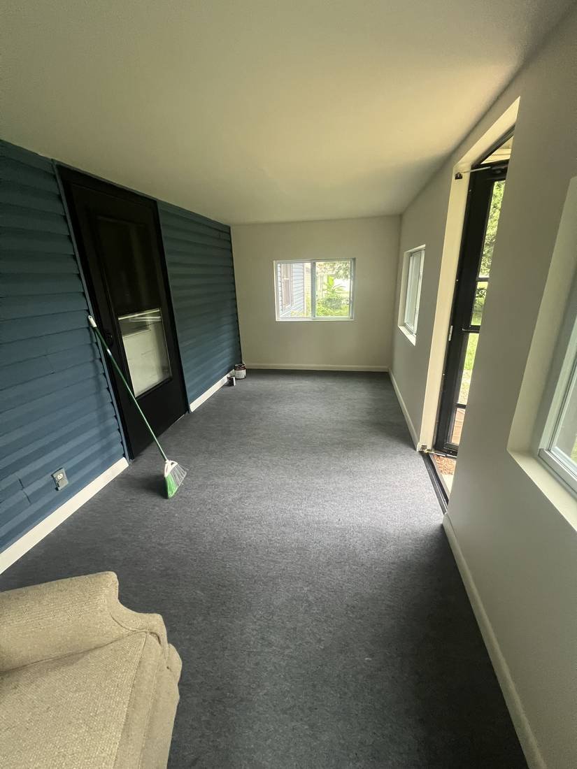 Finished interior of the enclosed porch with new carpet and drywall, Murfreesboro, Tennessee