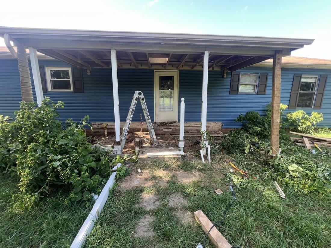Porch decking and railing removed during demolition, framing exposed, Murfreesboro, Tennessee