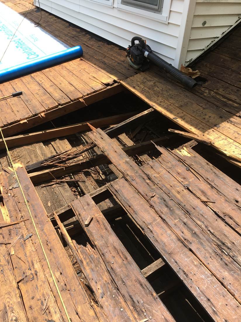 Severely rotted roof decking exposed during a full roof replacement in Tennessee