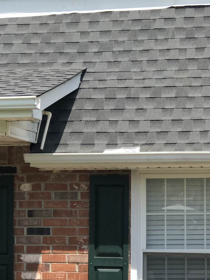 Close-up of new architectural shingles at a roof valley on a hip roof home in Middle Tennessee
