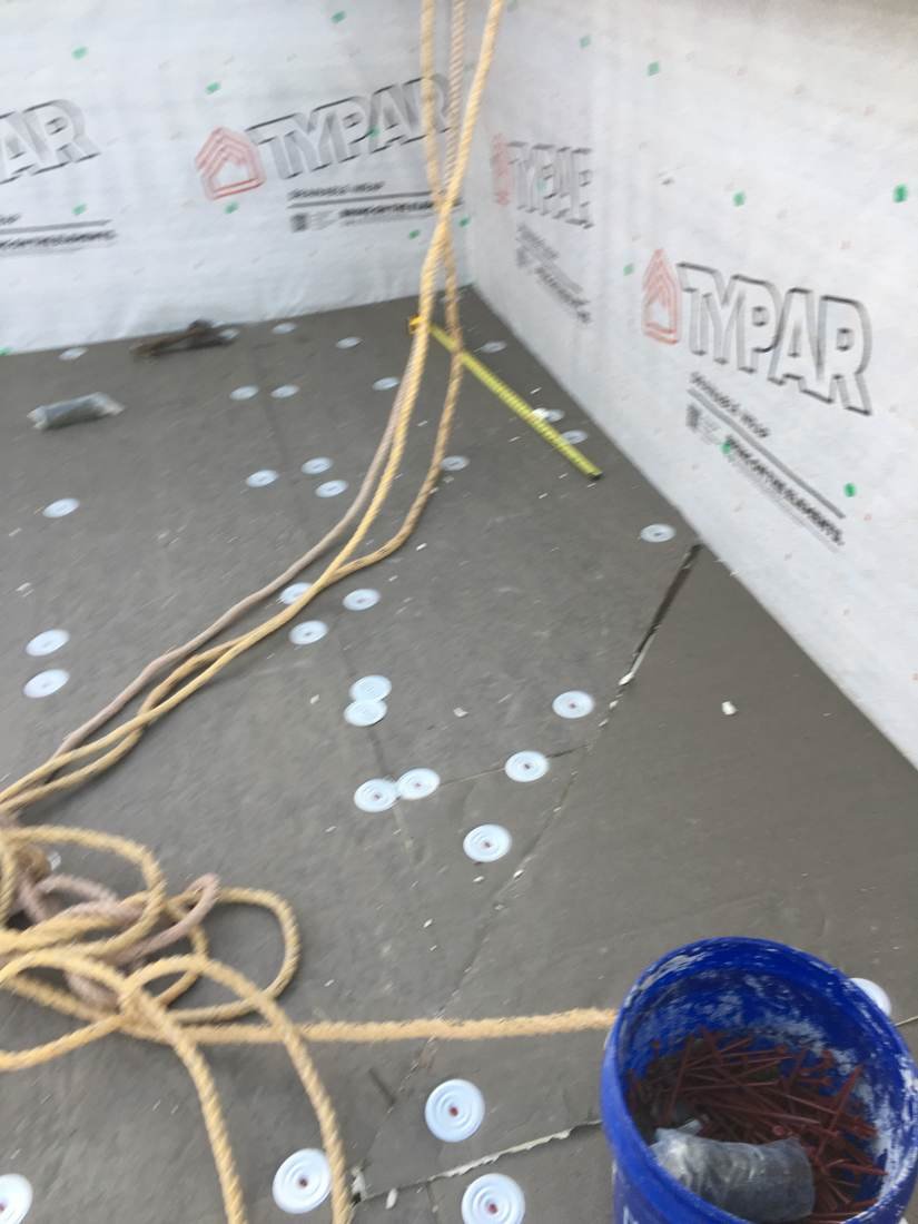 Flat roof insulation board staged for membrane installation on an apartment building in Knoxville, Tennessee