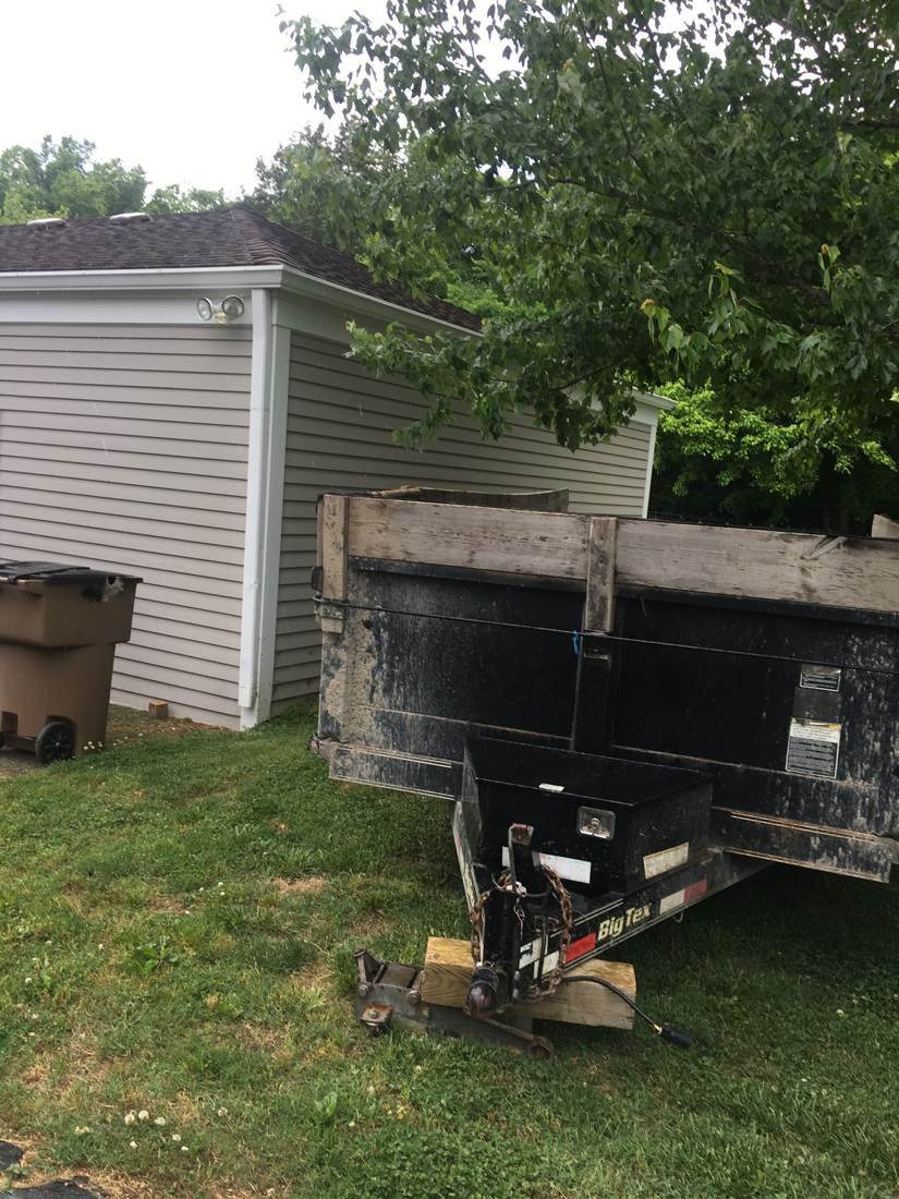 Dumpster full of old roofing debris torn off during a Murfreesboro, Tennessee roof replacement