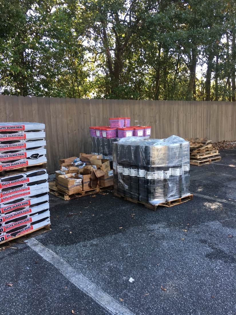 Shingles and roofing materials staged for an apartment complex reroof, Statesboro, Georgia