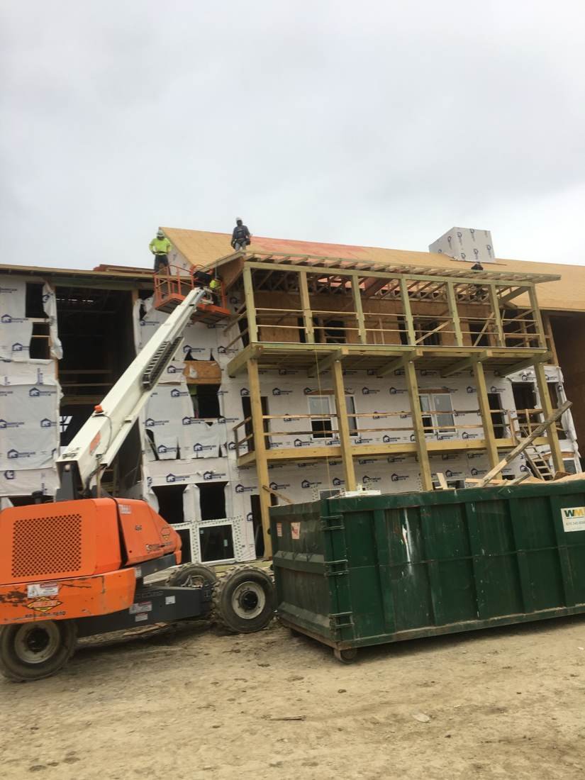 New building framing, house wrap, and roof decking under construction on an apartment building near downtown Nashville, Tennessee