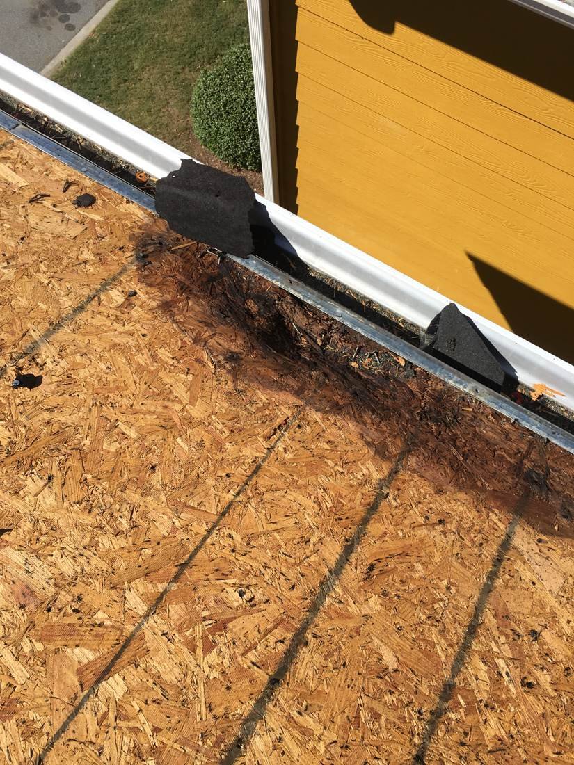 Rotted decking at the roof edge patched with felt before drip edge installation, Statesboro, Georgia apartment complex
