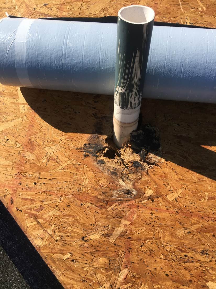 New pipe boot flashing installed on an apartment building roof, Statesboro, Georgia